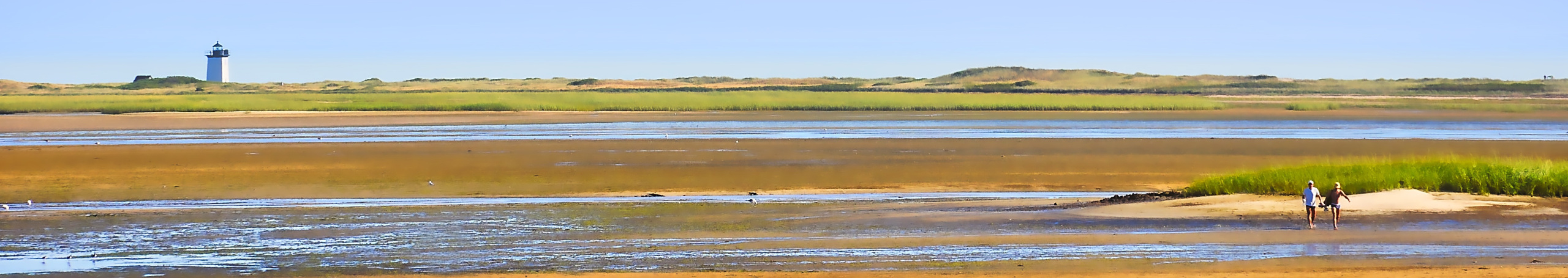 Couple walking on Cape Cod beach flats